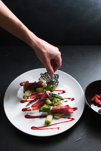 Talented chef plating a dish